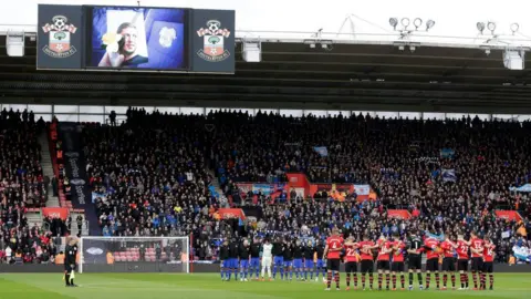 Getty Images Players, officials and fans take part in a minute of silence in tribute to Emiliano Sala prior to the Premier League match between Southampton FC and Cardiff City at St Mary's Stadium