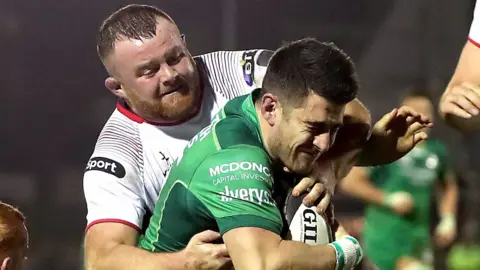 Andrew Warwick tackles Tiernan O'Halloran