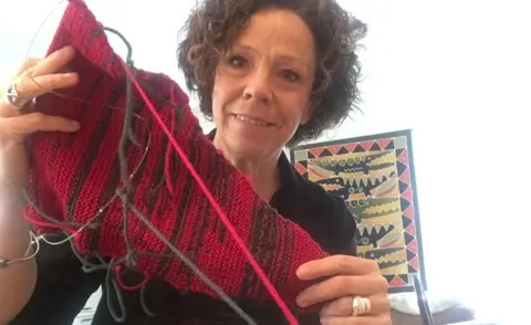 Councillor's colour-coded knitting shows 'men talk too much