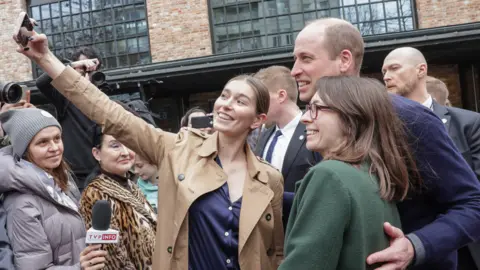 PA Media People taking selfies with Prince William