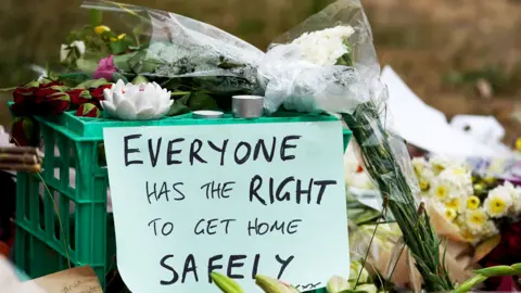 EPA Flowers left in tribute to Aiia Maasarwe