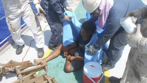 EPA Adil is seen on a ship after being rescued