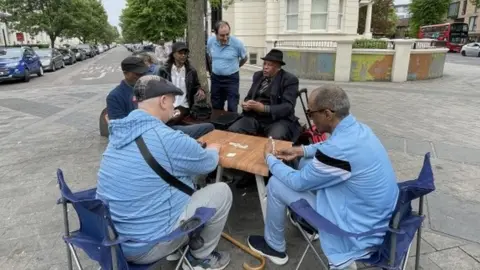 Ernest Theophil and friends playing cards