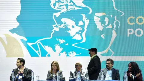 AFP FARC leader Rodrigo Londono Echeverri, known as "Timochenko"(C) gets ready to speak during the opening of their National Congress in Bogota on August 27, 2017.