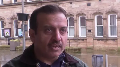 Councillor Mohammed Iqbal speaking to the BBC outside the town hall in Nelson