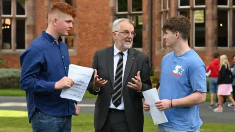 Michael Cooper Campbell College pupils Alex Meyer, and James McConnell, who both achieved 11 A* or A grades