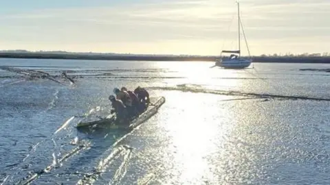 Essex County Fire and Rescue Service A yacht stuck in mudflats in Essex