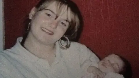 Northumbria Police Colette Myers holding a baby