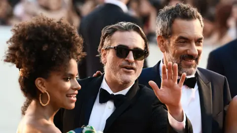 AFP Zazie Beetz, Joaquin Phoenix and Todd Phillips