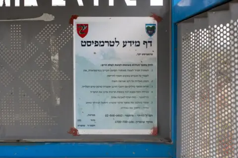 Geraldine Hope Ghelli Warning sign about hitchhiking