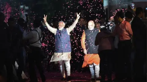 AFP Indian Prime Minister Narendra Modi (L) flashes the victory sign next to president of the ruling Bharatiya Janata Party (BJP) Amit Shah as they celebrate their victory in India's general elections, in New Delhi on 23 May 2019.