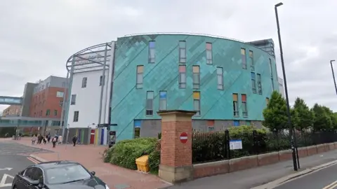 Google A large green hospital building