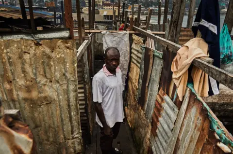 Hugh Kinsella Cunningham J Roberts in his washing facility