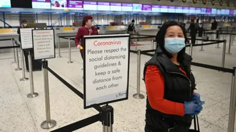 Getty Images Passenger in near-empty airport