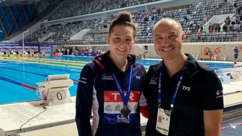 Jamie Main Mia Slevin (l) and coach Jamie Main