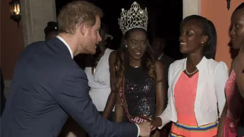 PA Prince Harry shakes hands with guest