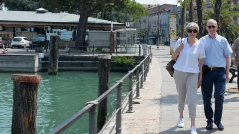 PA Theresa May and her husband Philip in Italy