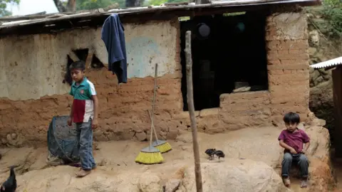Getty Images Children stay in front of their humble home in El Magueyito, Guerrero State, Mexico, on July 19, 2015.