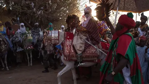 AFP Emir of Kano on horseback at a durbar for his coronation in 2014 in Kano, Nigiera
