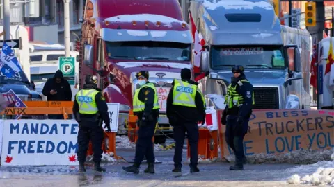 EPA Policemen stand near the truckers sit-in