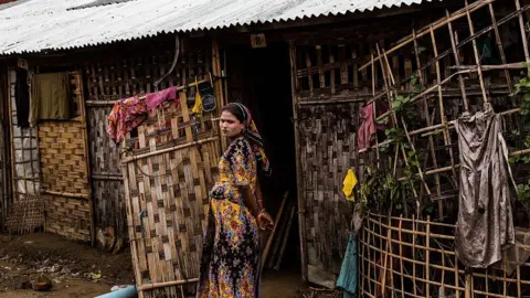 Getty Images A Rohingya woman stands outside of her tent inside the IDP camps in Sittwe, Rakhine State Myanmar