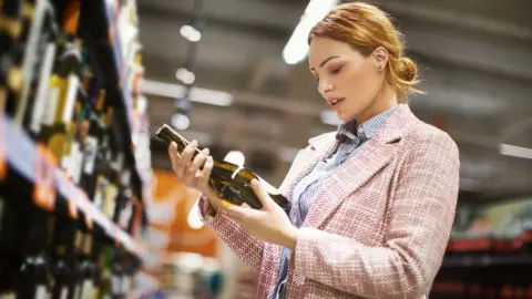 Shoppers swap clothes for alcohol amid record sales drop