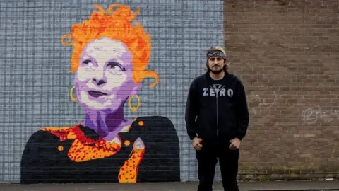 Deggy Deggy with his mural of Vivienne Westwood