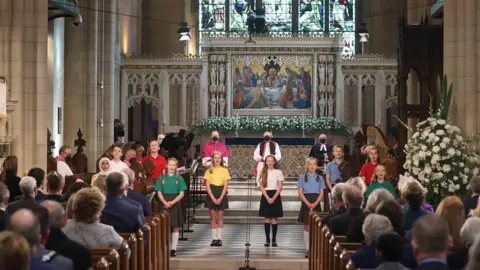 Pacemaker A children's choir during the church service marking Northern Ireland's centenary