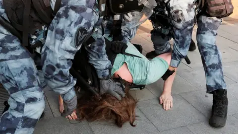 Reuters Police detain a protester in Moscow, 27 July