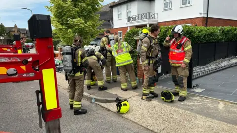 Essex County Fire & Rescue Service Firefighters at the scene of a house fire in Bishopsteignton, Shoeburyness, Essex