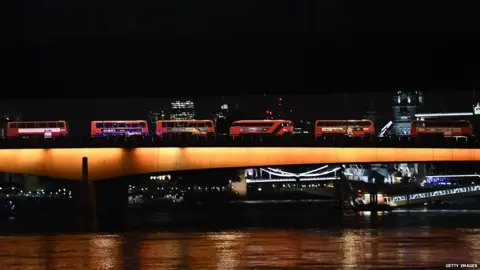 Getty Images Night buses on London Bridge