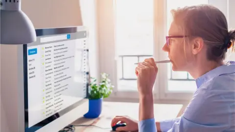 Getty Images Woman in front of computer screen