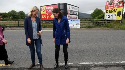 Brian Lawless/PA Irish minister Helen McEntee and the French Minister for Europe AmŽile de Montchalin stand on either side of the border on 19 July