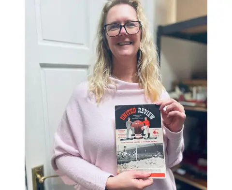 Hanson Ross Amanda Butler holding the programme