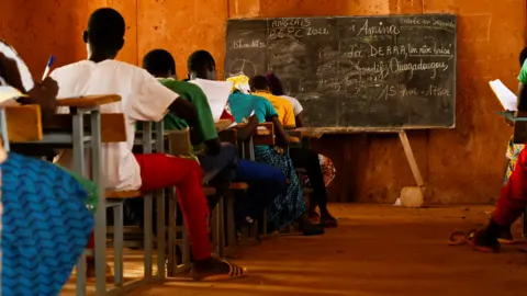 Reuters Students writing exams in a classroom in Gando, Burkina Faso - Friday 3 June 2022