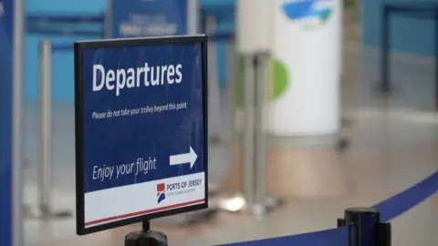 BBC Departures sign at Jersey airport