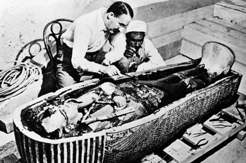 Getty Images Howard Carter with Tutankhamun's coffin