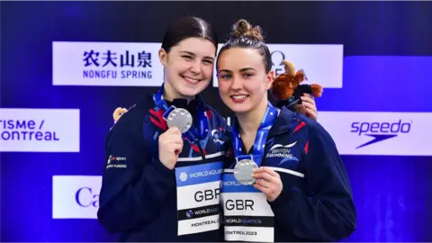 Andrea Spendolini-Sirieix and Lois Toulson on the podium with their silver medals