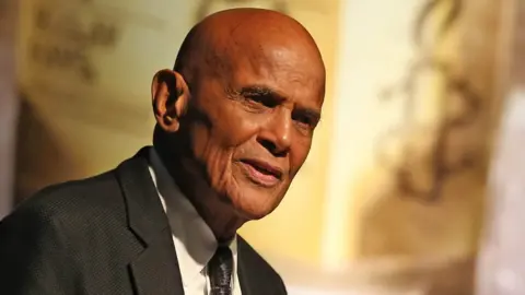 PA Media File photo dated 17/09/13 of Harry Belafonte speaking after he was presented with the Amnesty International Ambassador of Conscience award for 2013 at a ceremony in the Mansion House Dublin