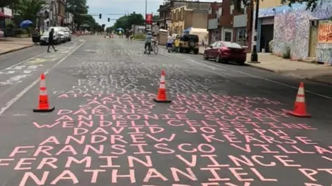Angelique Negroni-Kearse Chicago Avenue, Minneapolis, site of George Floyd death, painted with names of people who died in police custody