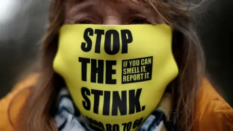 Reuters Stop the stink protestor