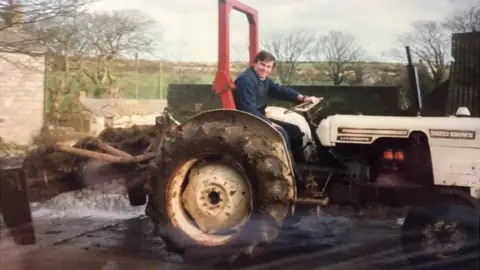 Simon Martyn Matthews Young Simon Martyn Matthews on a tractor