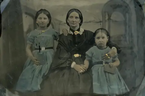 Margaret Hedley Hand-coloured photograph of Hannah Porter with her daughters, Sarah and Susanna in 1862