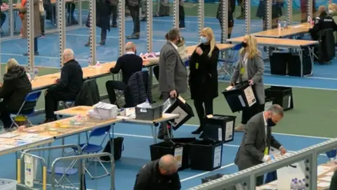 BBC A socially-distanced count with ballot boxes