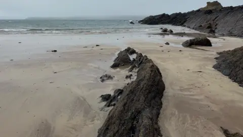 BBC Beach with rocky outcrop