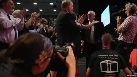 Getty Images Jeremy Corbyn being greeted on stage after finishing his leader's speech