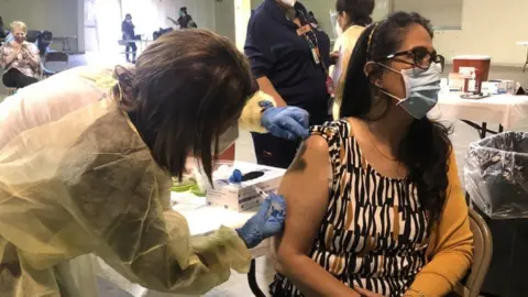 Reuters A woman receives a Covid vaccine in Jim Hogg County, Texas