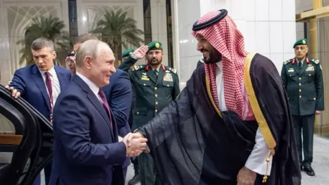 ROYAL COURT OF SAUDI ARABIA / HANDOUT Saudi Arabian Crown Prince Mohammed bin Salman (R) welcomes Russian President Vladimir Putin (L) at Al Yamamah Palace in Riyadh, Saudi Arabia on December 06, 2023.