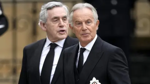 Getty Images Tony Blair and Gordon Brown arrive for the Queen's funeral