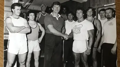 Ian Edmed Dave Prowse with Frank Zane at his gym